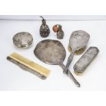 An Art Deco period Far Eastern white metal part dressing table set and other items, with engraved