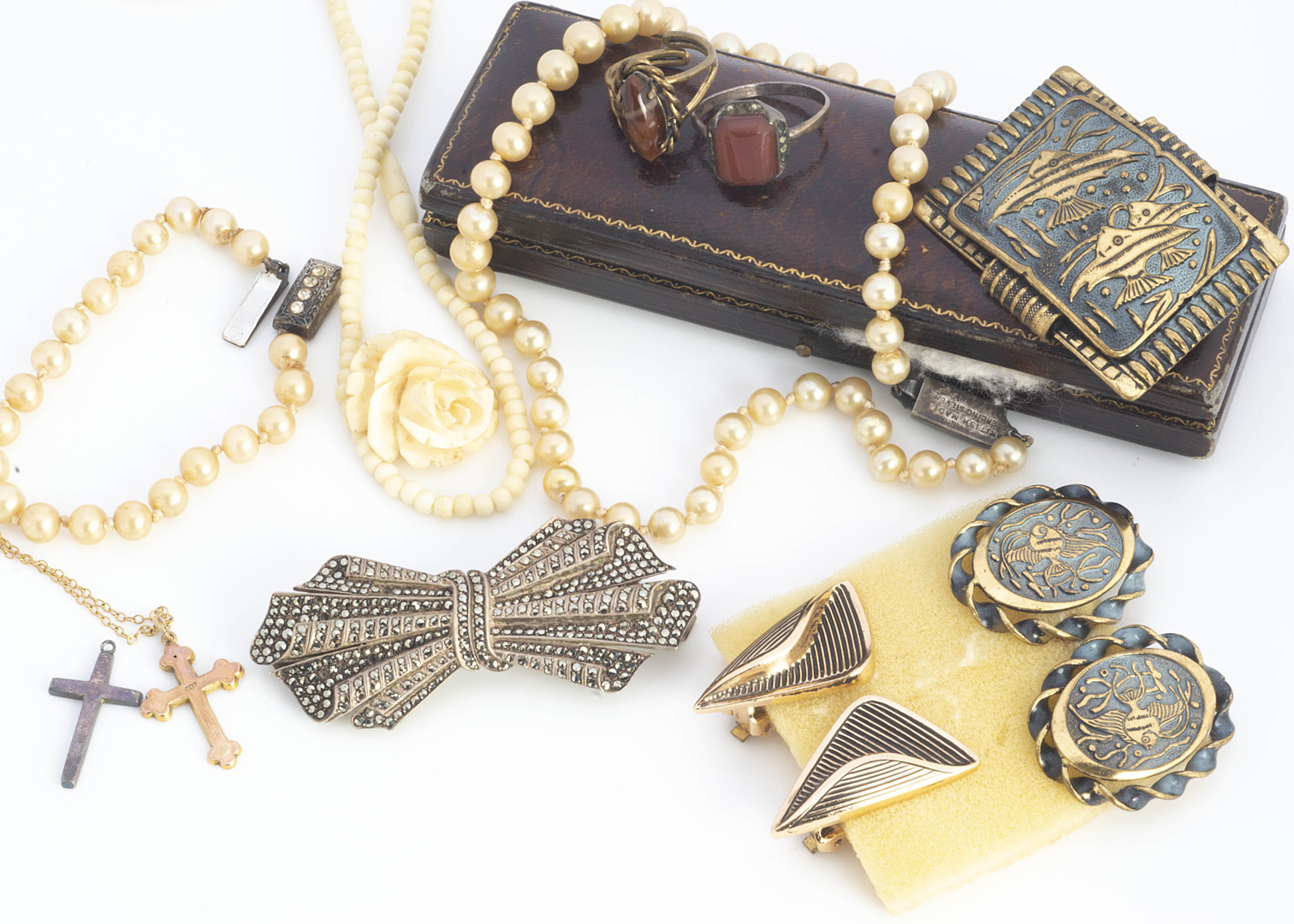 A collection of costume jewels, including a marcasite double clip brooch, a 9ct gold cross pendant
