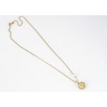 A 9ct gold cultured pearl pendant and chain, shell hinged pendant with drilled pearl, 23.5 cm