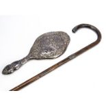 An Edwardian silver hand mirror and a later silver mounted walking stick