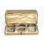 A pretty first half 20th century continental silver and hand painted set of six menu holders, in