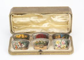 A pretty first half 20th century continental silver and hand painted set of six menu holders, in