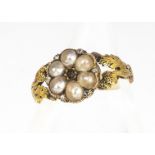 A 19th century gold, diamond and seed pearl posy ring, centred with a flower head tablet with six