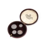 An Edward VII Maundy Money four coin set, in circular Spink fitted case, dated 1907 EF