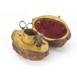 A 19th century walnut sewing etui, the gilt fitted interior containing miniature scissors,