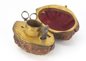 A 19th century walnut sewing etui, the gilt fitted interior containing miniature scissors,