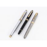 Three modern fountain pens, including a Mont Blanc Meisterstuck in black with gold mounts and 14ct