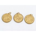 Three yellow metal half sovereign style coins, all dated George V 1912, in 9ct gold mounts, 16.7g