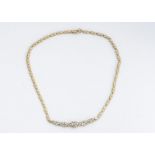 An 18ct gold continental diamond necklace, the flattened heart shape links supporting five oval