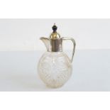 A Edward VII silver and cut glass globular claret jug, plain silver collar and handle with ebony