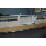 Three counter top display cabinets, each 120cm x 61cm x 101cm high on plinth bases (3)