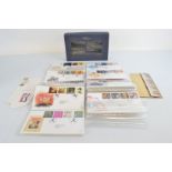 A collection of Millennium first day covers, in a blue Royal Mail presentation box with other