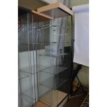 An open display cabinet, having five glass shelf interior on plinth base, 48cm x 44cm x 186cm high