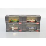 Four Kyosho Formula-1 Collection models, 7086-1, 7085-2, 7086-2, 7083-1, all in plastic display