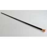 A George V 9ct gold and ebony walking cane, the tapered stem with horn ferrule, monogrammed RW 1926,