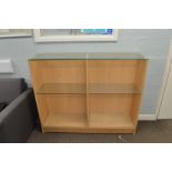 Two contemporary open bookcases, having adjustable glass shelves and glass top, plinth base, each