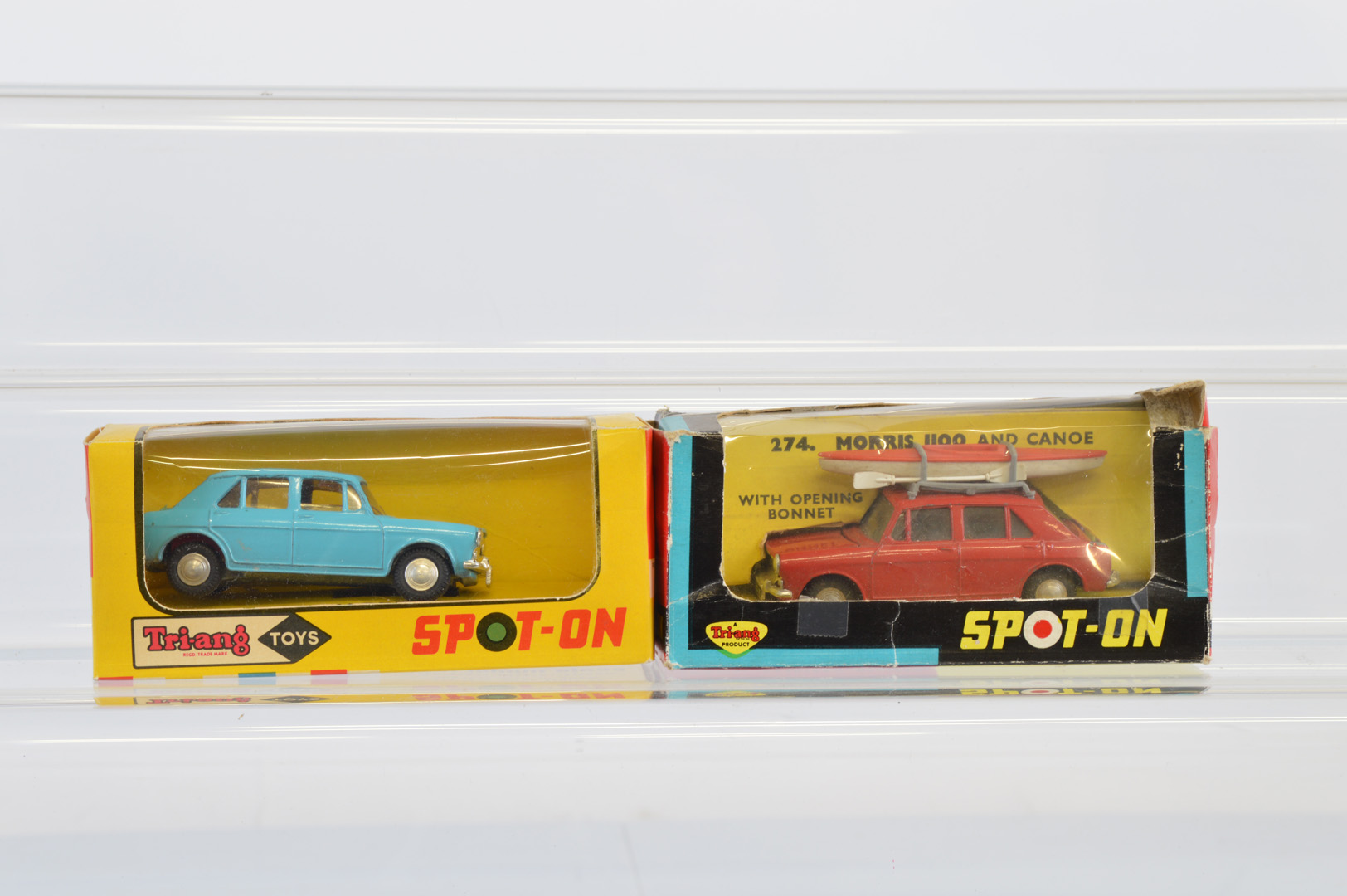 A boxed Tri-ang Spot-On 274 Morris 1100 and Canoe in red, G/G+ in a P/F box, together with a