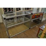 Two open counter top display cabinet, having glass shelf interior, 120cm x 55.5cm x 91cm high