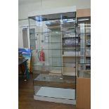 An open display cabinet, having four glass shelf interior, 91cm x 47cm x 188cm high