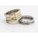 Two yellow and white metal rings, both marked Bvlgari, both stamped 750, one set with brilliant