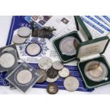 A collection of coins, including a George V 1935 crown, various other British crowns, £5 coin,