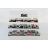 Thirteen Onyx Formula 1 1/24 scale diecast models, all contained in plastic display cases.