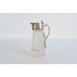 A Victorian silver and cut glass claret jug, the tapered hobnail cut body with engraved panel of a