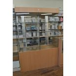Two display cabinets, having six shelf glass interior over two division open bottom section, 121cm x