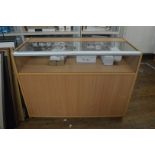 An open counter top display cabinet, having four division pigeon hole section to reverse, 121cm x