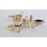 A collection of silver, including a silver sauce boat, a pair of Victorian silver crimped salts, two