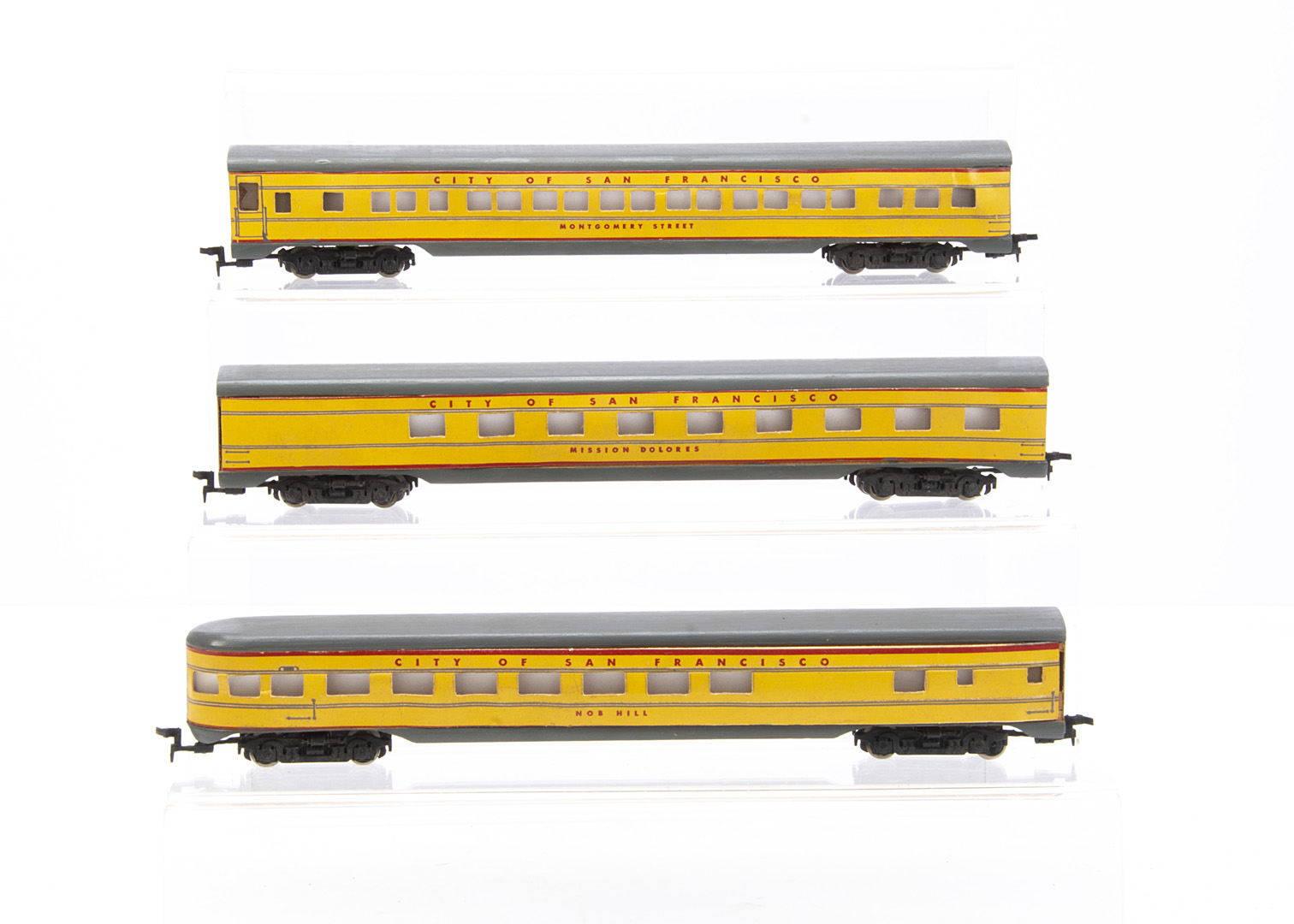 A Rivarossi Wood and Card 3-car American Union Pacific Coaches Proving Set, all in UP yellow with