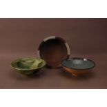 Three contemporary studio pottery bowls, comprising, a green earthenware bowl by Richard Phethean