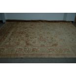 A second half 20th century Pakistan woollen carpet, faded, approx. 356cm by 272cm