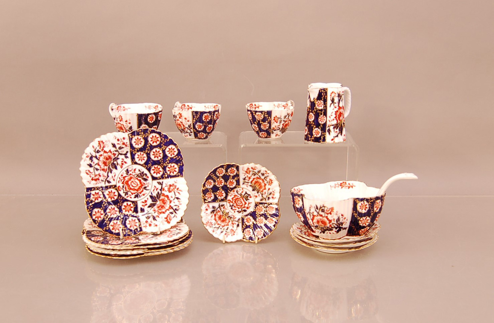 A selection of Royal Crown Derby 'Imari' pattern porcelain, comprising five side plates, four