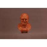 A mid 20th century ceramic bust of Churchill as a light, 21cm high, removable cigar, marked to the