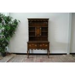 A Victorian oak dresser, in the George II style, with two drawers to lower section, 107cm wide and
