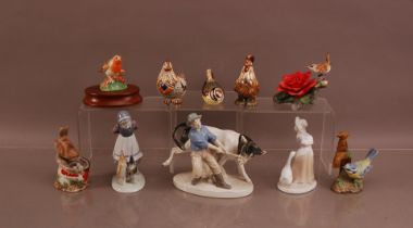 A collection of ceramic animals and figural groups, including a Royal Crown Derby enamel bird