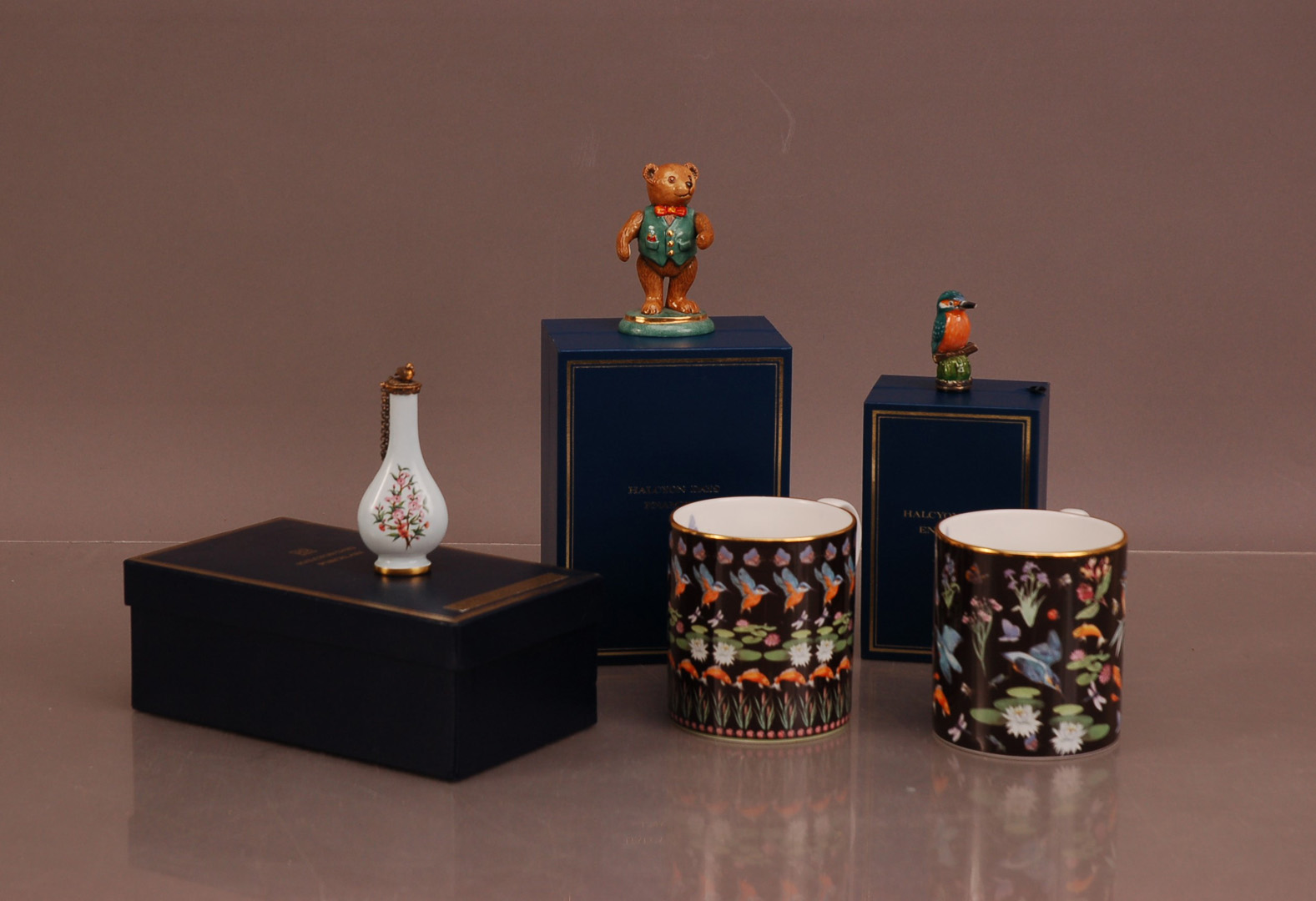 A group Halcyon Days items, comprising a Porcelain bottle necked scent bottle 9cm high in its retail