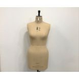 A vintage Kennett & Lindsell Ltd dress makers dummy, size 18, on stand with casters