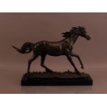 After P.J. Mene, A bronze of a golloping horse, on a rectangular base, 39cm x 52cm