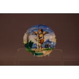 A 20th century cantagalli small plate, depicting a hand painted cherub playing the drum by the