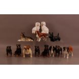 A collection of ceramic dogs, comprising six Beswick examples, and two early 20th century