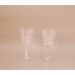 Two 20th century large cut glass wine glasses, 21cm and 20cm high, both with hunting scene