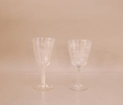 Two 20th century large cut glass wine glasses, 21cm and 20cm high, both with hunting scene