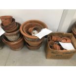A group of terracotta garden pots, eleven of varying sizes, tallest 33cm high, and a box of