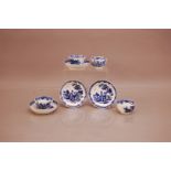 Four late 18th century Worcester blue and white tea bowls and saucers, cups 4.5cm high, the