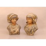 Two early 20th century cast metal busts of eastern women, both 41cm high, wear to the paint work,