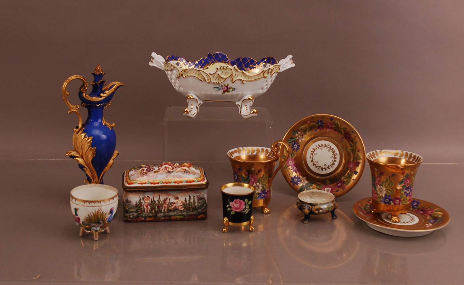 A collection of continental ceramics, including a pierced late 20th century Limoges porcelain