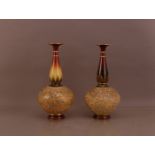 A pair of Doulton onion vases, marked to the bases, 43cm high, of slightly differing designs (2)