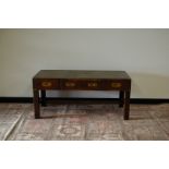 A 20th century campaign style coffee table, 120cm wide x 55cm deep x 54cm high, tooled leather